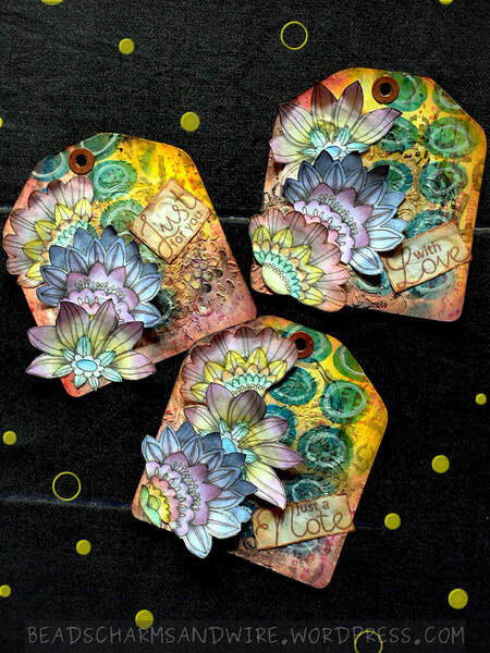 Flowery mixed media tags by Anita