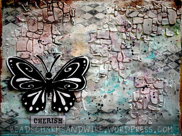Art journal page with textured background and a black-and-white butterfly in the foreground